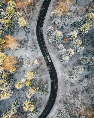 Truck on road after a heavy snowfall in mid winter season